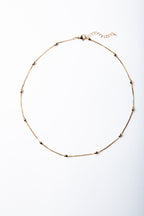 Collar María con cadena lisa y bolitas ovaladas – María Larraín